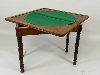 Turned wood game table with green fabric...