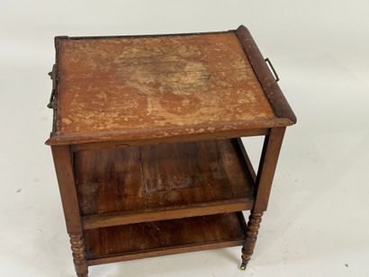 Small three-tier mahogany side table on casters.
49...