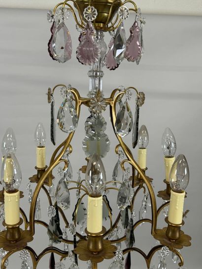 Brass chandelier with eight lights and crystal...