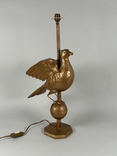 Gilded metal lamp base featuring a bird resting...