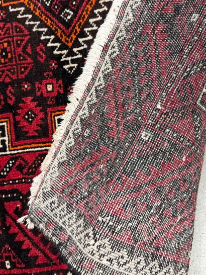 Hand-knotted wool rug with stylized motifs...