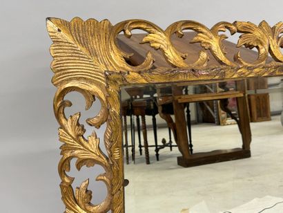 Mirror in gilded wood, with openwork and...