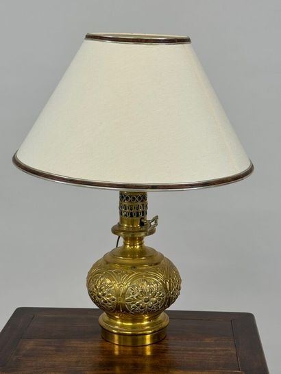 LOB.
Oil lamp in repoussé brass, mounted...
