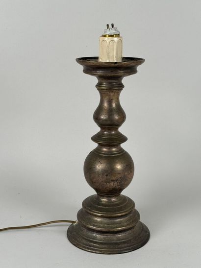 Metal candlestick, circular base.
Mounted...