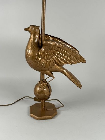 Gilded metal lamp base featuring a bird resting...