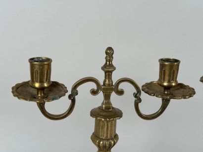 Pair of bronze torches with two arms, the...