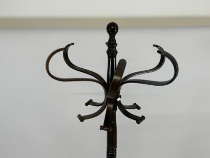 Stained wood coat rack with five pegs.
H....