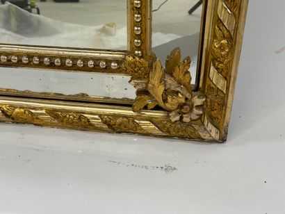 Wood and gilded stucco glazed mirror decorated...