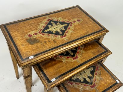 Series of three gilded wood nesting tables,...
