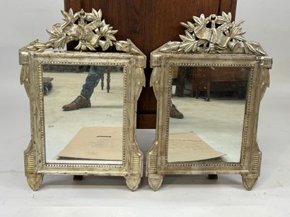 Pair of carved wood and silver-plated mirrors...