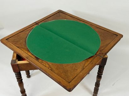 Turned wood game table with green fabric...