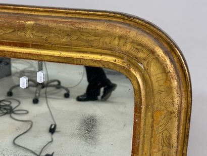 Wood and gilded stucco mirror, the upper...
