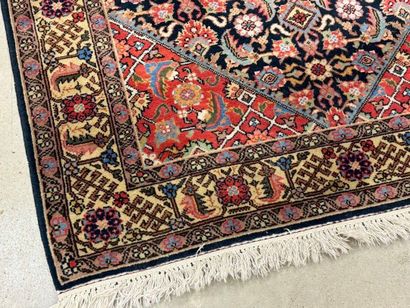 Oriental rug in knotted wool decorated with...