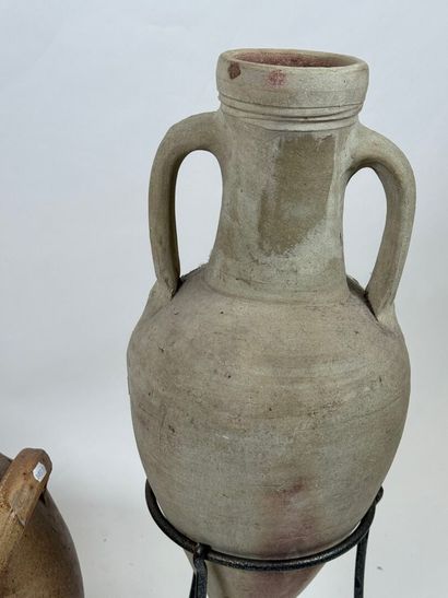Jug and amphora presented on a tripod metal...