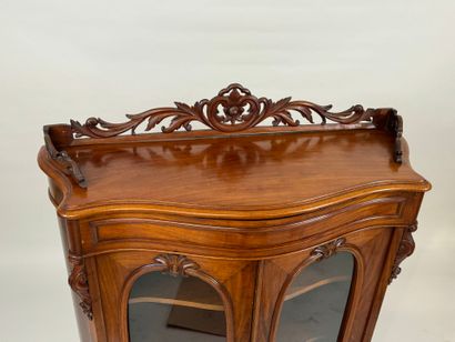 Small curved wooden display cabinet opening...