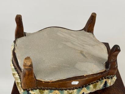 Small wooden footrest with colored fabric...