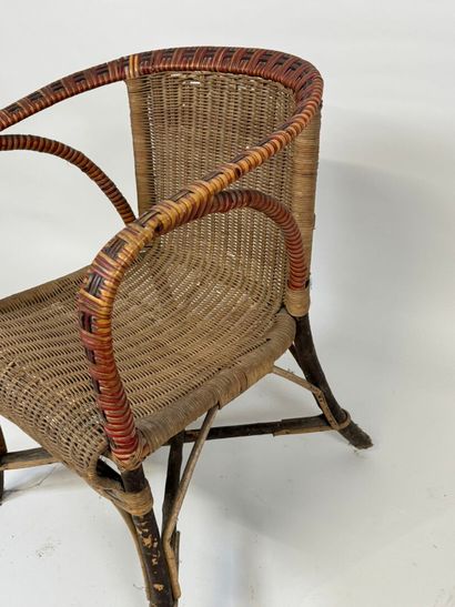 Wood and rattan armchair, X-shaped brace.
70...