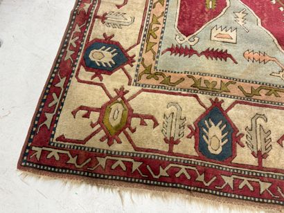 Large hand-knotted wool rug with stylized...