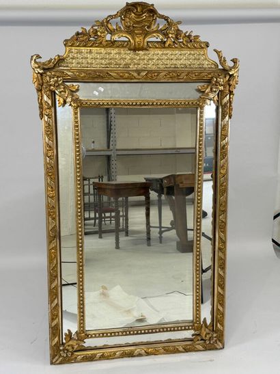 Wood and gilded stucco glazed mirror decorated...