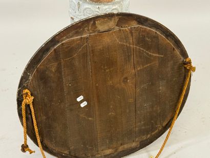 Oval wood and gilded stucco mirror decorated...