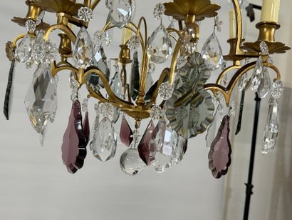 Brass chandelier with eight lights and crystal...