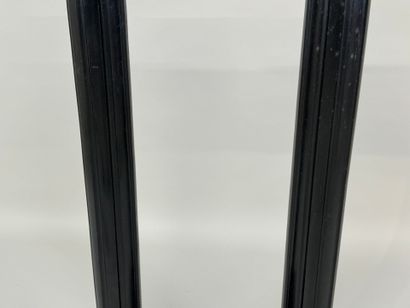 Two blackened wood saddles, fluted shaft,...