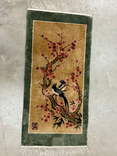 Small silk carpet with polychrome decoration...