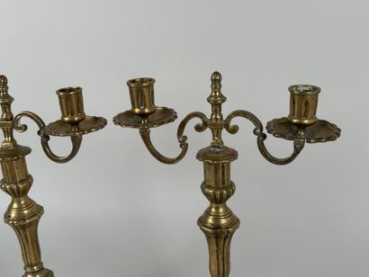 Pair of bronze torches with two arms, the...