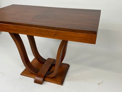Small wooden dining table with basin base.
74...
