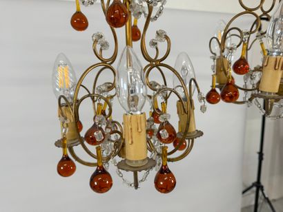 Pair of gilded metal chandeliers with colored...