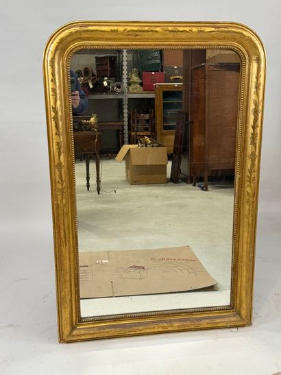 Wood and gilded stucco mirror decorated with...