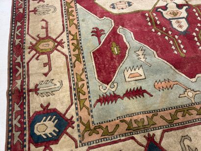 Large hand-knotted wool rug with stylized...