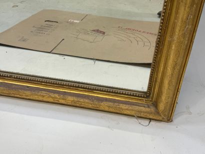 Wood and gilded stucco mirror decorated with...