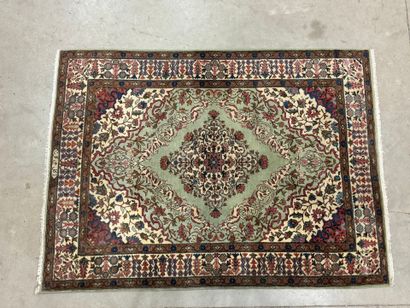 Oriental hand-knotted wool rug decorated...