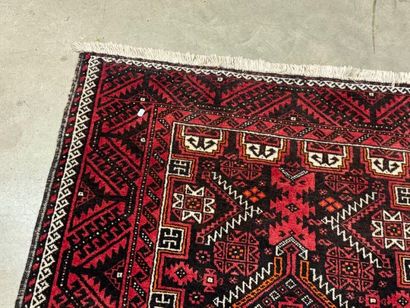 Hand-knotted wool rug with stylized motifs...