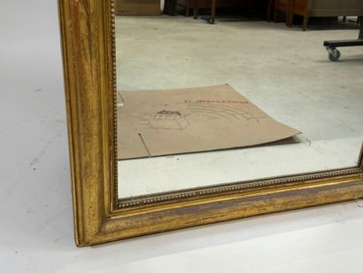 Wood and gilded stucco mirror decorated with...
