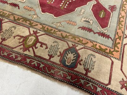 Large hand-knotted wool rug with stylized...