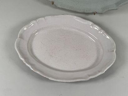 Two black butt plates, scalloped edge.
38...