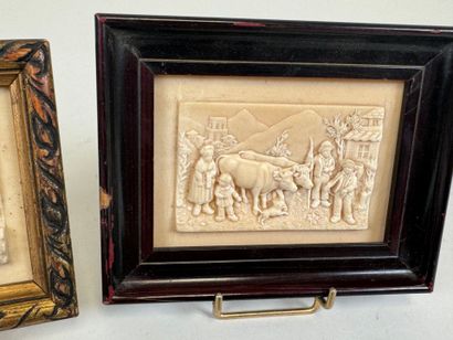 Two petrified limestone plaques decorated...