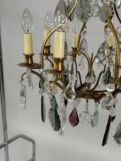 Brass chandelier with eight lights and crystal...
