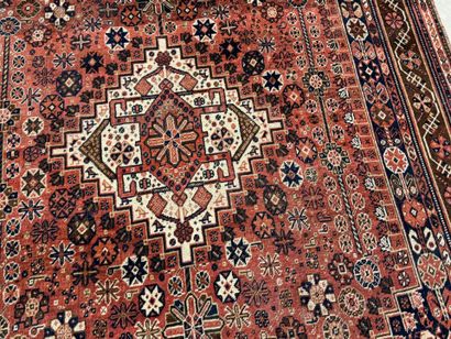 Oriental hand-knotted wool rug with stylized...