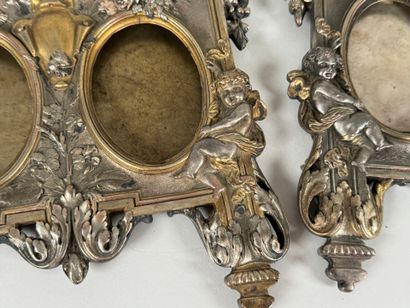 Pair of three-slot picture frames in metal...