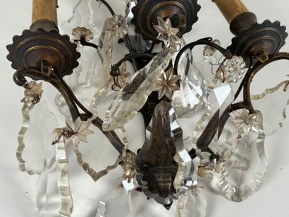 Bronze three-arm sconce with crystal pendants.
H....