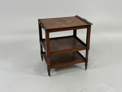 Small three-tier mahogany side table on casters.
49...