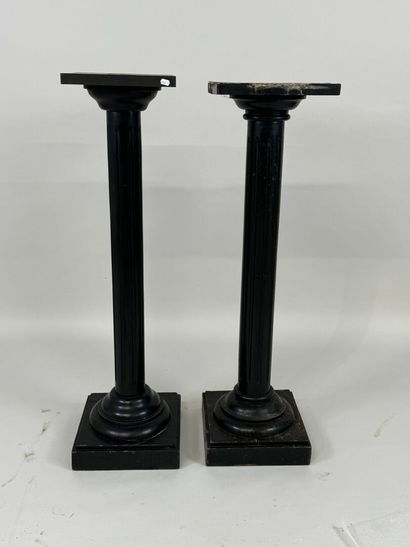 Two blackened wood saddles, fluted shaft,...