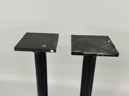 Two blackened wood saddles, fluted shaft,...