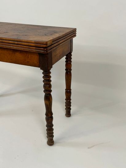 Turned wood game table with green fabric...