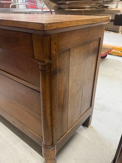 Natural wood chest of drawers with half detached...