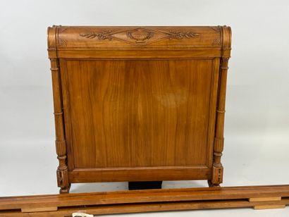 Carved wood bed decorated with basins and...