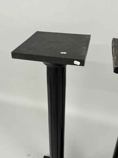 Two blackened wood saddles, fluted shaft,...